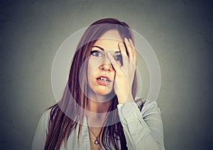 Portrait of desperate young worried woman