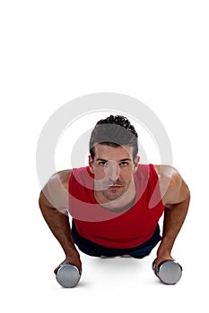 Portrait of determined sportsperson exercising with dumbbells photo