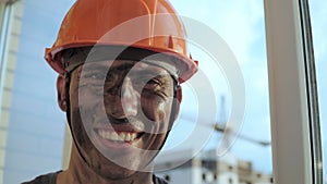 Portrait Dirty Building Worker Background Construction Crane. Handsome Caucasian Man in Hard Hat Smiles. People Working Equipment