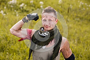 Portrait dirty man shows strength and muscles