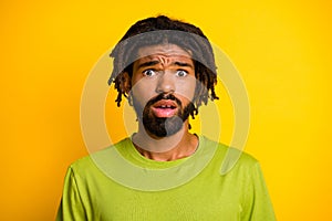 Portrait of disappointed afraid dark skin guy look in camera feel worried isolated over vibrant yellow color background