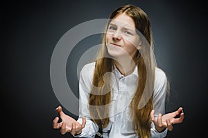 Portrait of disappointed girl isolated on gray background. Negative human emotion, facial expression. Closeup
