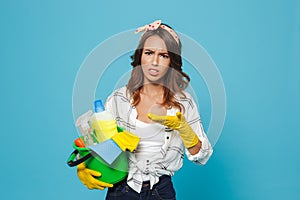 Portrait of disappointed outraged housemaid 20s wearing yellow r