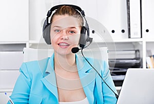 Portrait of dispatcher female which is talking with client