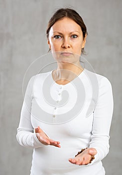 Portrait of displeased adult woman posing in studio