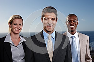 Portrait, diversity and business people with pride in group for corporate team, outdoor and smile by ocean. Men, woman