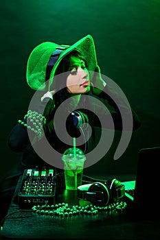 Portrait dj headphone st Patrick green hat cocktail drink equipment disco girl party desk mixer glamour disc young woman girl