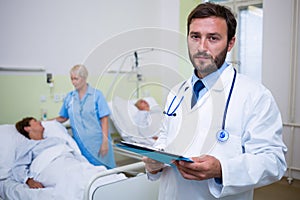 Portrait of doctor checking a medical report