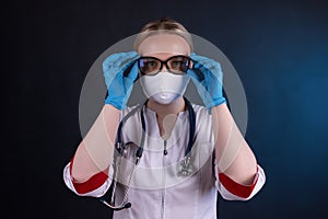 Portrait of a doctor with glasses and a medical mask