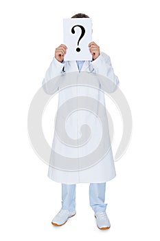 Portrait of doctor holding paper with question mark