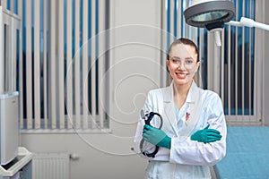 Portrait of a doctor looking at the camera. A young woman is smiling. Health care, medical. Combined medicine, spanien photo