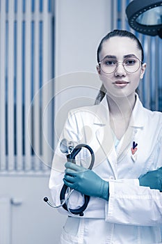 Portrait of a doctor looking at the camera. A young woman is smiling. Health care, medical. Combined medicine, spanien photo