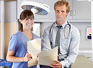 Portrait Of Doctor And Nurse In Doctor's Office