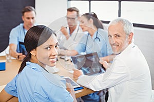 Portrait of doctors smiling in conference room