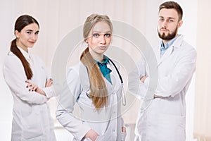 Portrait of doctors in white coats in the hospital ward