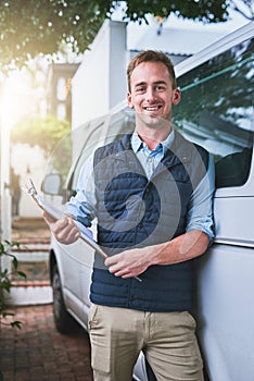 Portrait, documents and a delivery man with his van, checking a clipboard for an order or address. Logistics, ecommerce