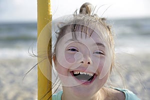 Portrait of down syndrome girl smiling