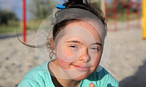 Portrait of down syndrome girl smiling