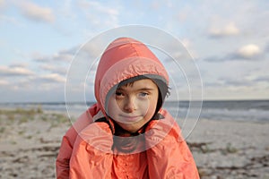 Portrait of down syndrome girl smiling on background of the sea