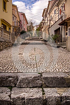 Portrait down up view of main cobblestone street in old city.City of Bakar, Croatia.