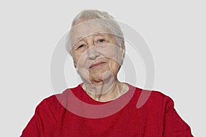 Portrait of a dreaming senior woman sitting with closed eyes.