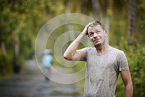 Portrait of drenched man in rain