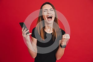 Portrait of ecstatic woman 20s wearing black t-shirt screaming a