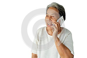 Portrait of elderly asian woman are using mobile phone with a smile isolated on white background