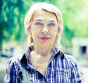 Portrait of elderly blonde woman