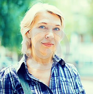 Portrait of elderly blonde woman