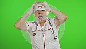 Portrait of elderly caucasian female doctor. Crazy and funny nurse