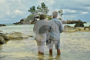 Portrait of elderly couple on a beach