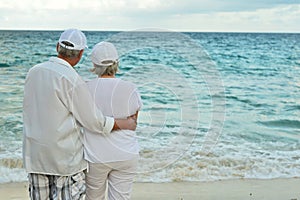 Portrait of an elderly couple on beach