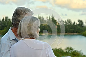 Portrait of elderly couple on beach back view