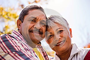 Portrait of elderly couple embracing