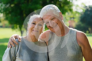 Portrait of elderly couple after fitness in park