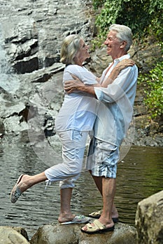 Portrait of an elderly couple resting on beach