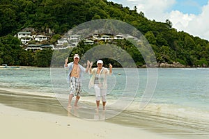 Portrait of elderly couple at tropical beach