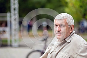Portrait of an elderly Gray-haired man sitting