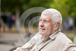 Portrait of an elderly Gray-haired man sitting