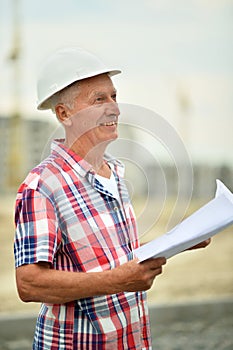 Portrait of an elderly man on a construction site