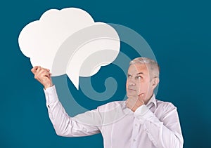 Portrait of elderly man holding speech bubble