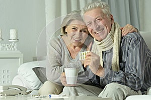 Portrait of elderly man and woman with flu.