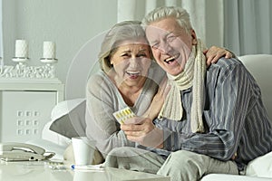 Portrait of elderly man and woman with flu.