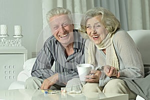 Portrait of elderly man and woman with flu