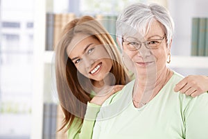 Portrait of elderly mother and daughter smiling photo