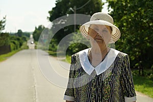 Portrait of elderly woman aged 80s dressed in hat