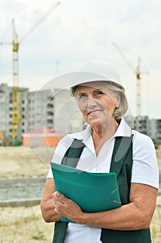 Portrait of an elderly woman on a construction site