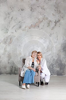 Portrait of elderly woman with her granddaughter