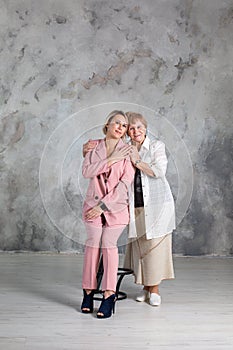 Portrait of elderly woman with her granddaughter